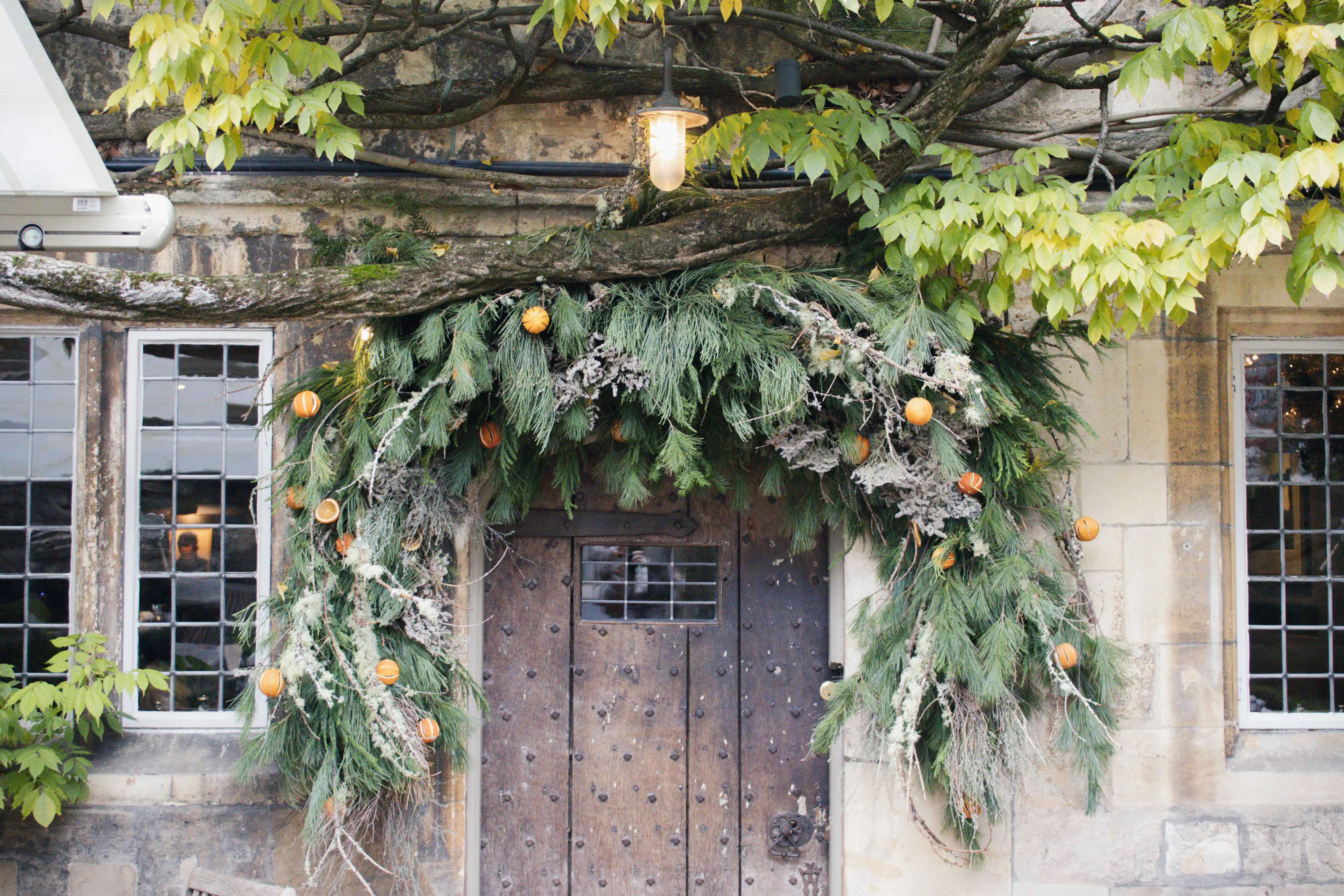 Front exterior door orange pine Christmas wreath